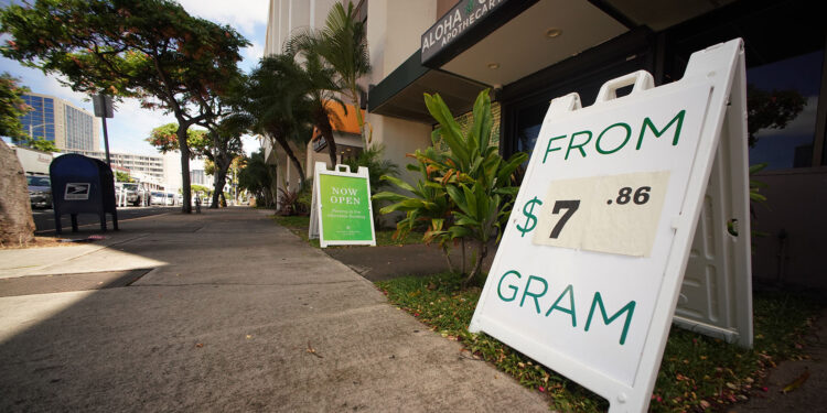 Aloha Green Apothecary  has a sign on the sidewalk $7.86 a gram of Cannabis/marijuana.