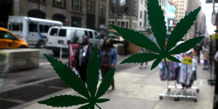 Cannabis stickers on a Weed World store window are pictured the day New York State legalized recreational marijuana use amid the coronavirus disease (COVID-19) pandemic in the Manhattan borough of New York City, New York, U.S., March 31, 2021. REUTERS/Carlo Allegri